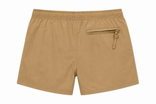 A pair of tan swim shorts with an elastic waistband and a zippered side pocket, shown from the back on a white background.