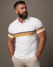 Man wearing a white polo shirt with brown and yellow stripes on a gray background