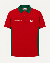 A red short-sleeve polo shirt with green collar and side panels, featuring 'PORTUGAL' printed in white on the chest alongside a white 'NC' logo. The brand 'NOM CHRISTIAN' is visible on the inner neck label.