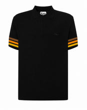 Black polo shirt with gold and orange stripes on sleeves against a white background